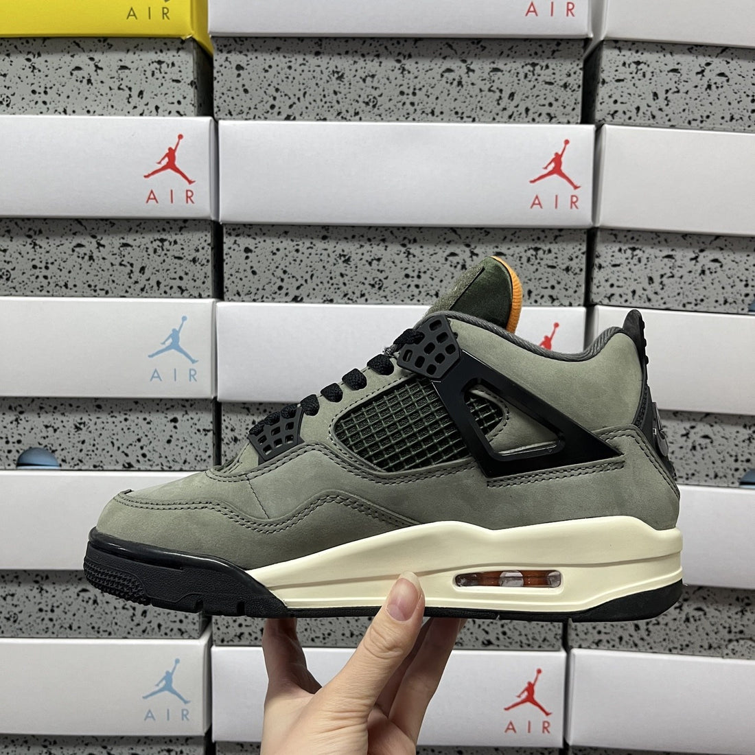Air Jordan 4 Undefeated Olive Orange